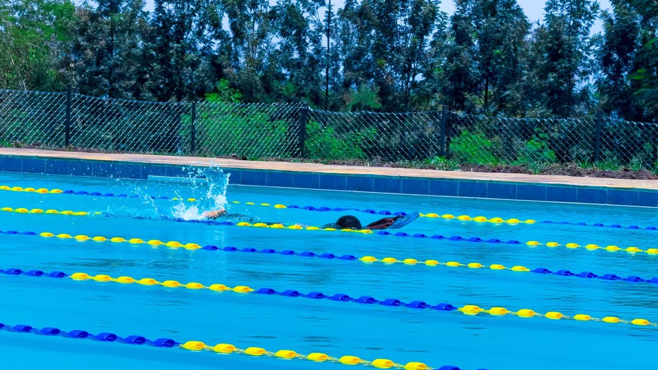 Swimmers in lanes during a competition heat